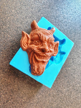Load image into Gallery viewer, Mocking devil's head Silicone Mold (11x8.5x3.2cm), for the production of repetitions of hand-made sculptures
